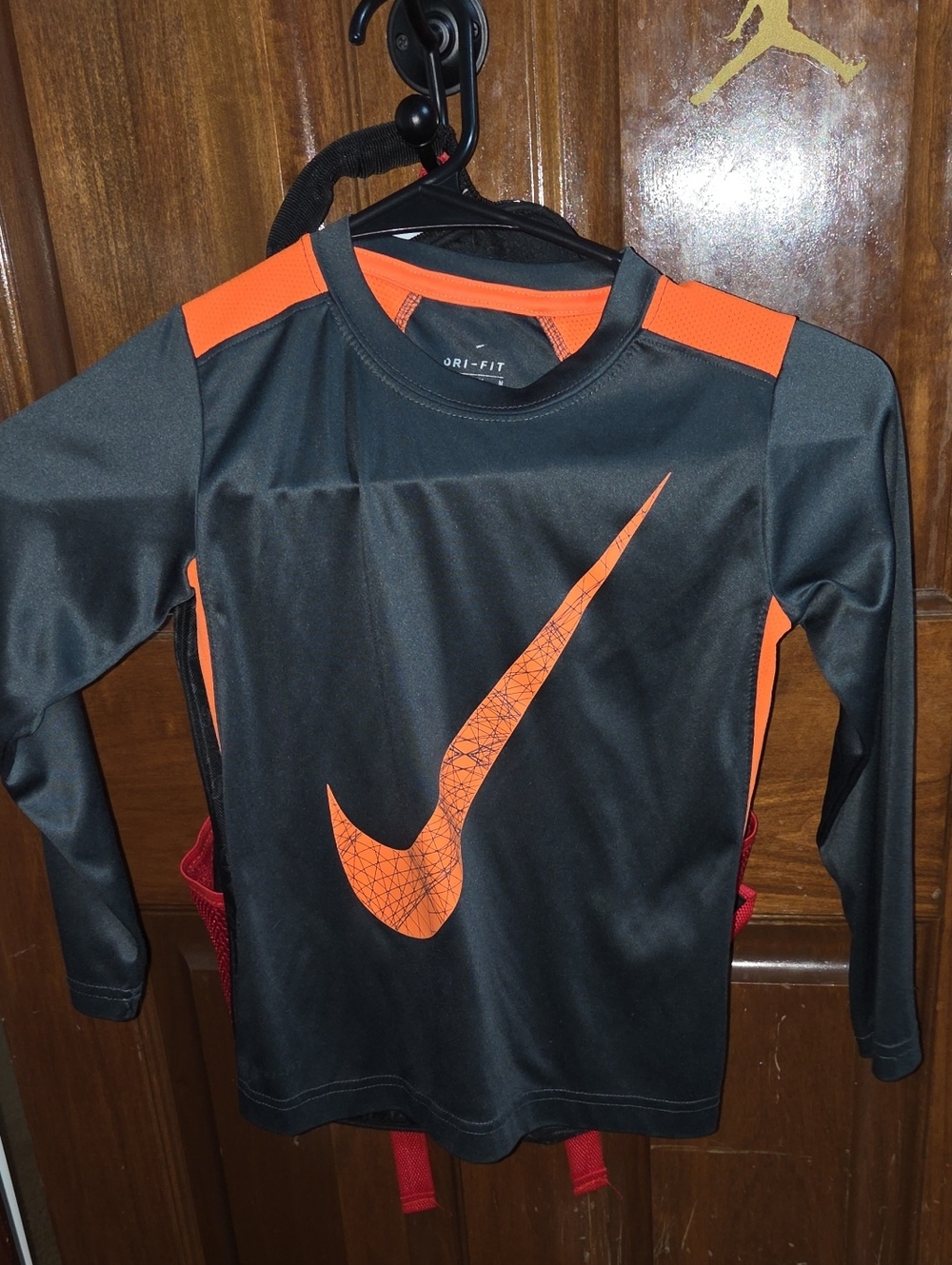 Boys Size 6 Nike Black Long Sleeve Dri-FIT Top with Orange Swoosh